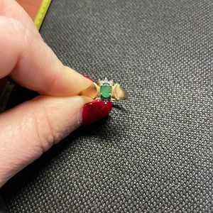 Yellow gold emerald and diamond accent ring